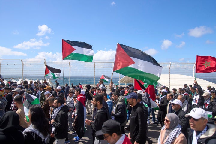 Moroccans outside the Tangier Med Port protest the docking of a Maersk cargo ship carrying airplane parts they suspect are headed to Israel, on April 20, 2025.