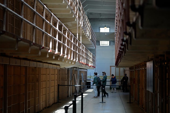 People tour the main cell house on Alcatraz Island in San Francisco, March 15, 2021, as the historic island prison was reopened to visitors after being closed since Dec. 2020, because of the coronavirus threat. (AP Photo/Eric Risberg, File)
