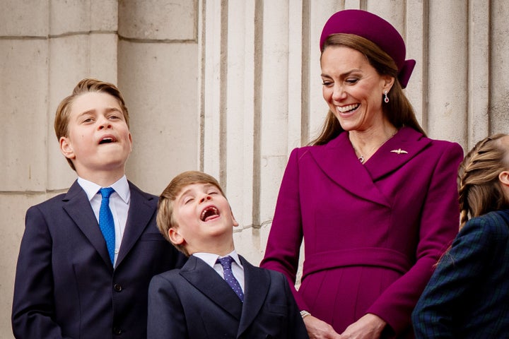 Prince George, Prince Louis, the Princess of Wales and Princess Charlotte stand on the balcony of Buckingham Palace in London on Monday to view the flypast for the anniversary of VE Day.