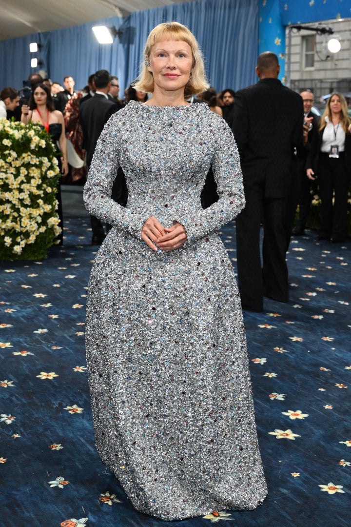 Anderson's structured dress is a departure from her usual style. 