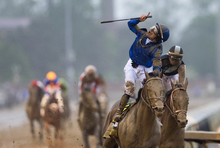 TOPSHOT - Venezuelan jockey Junior Alvarado rides Sovereignty to victory in the 151st running of the Kentucky Derby at Churchill Downs on May 3, 2025, in Louisville, Kentucky. Sovereignty powered through the final turn and overtook favorite Journalism in the final straight to win the Kentucky Derby on May 3, giving the Godolphin stable a first victory in the US racing classic at Churchill Downs.Untroubled by the sloppy track on a rainy day in Louisville, Sovereignty gave Venezuelan jockey Junior Alvarado a first Kentucky Derby win. (Photo by LEANDRO LOZADA / AFP) (Photo by LEANDRO LOZADA/AFP via Getty Images)