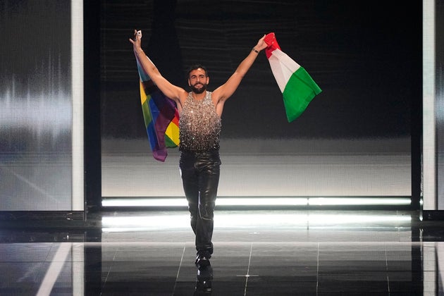 Italian singer Marco Mengoni waves a Progress Pride flag on stage at Eurovision in Liverpool back in 2023