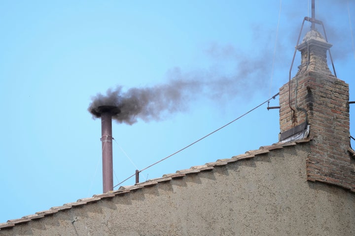 Black fume billows from nan chimney of nan Sistine Chapel during nan conclave to elite a caller pope, astatine nan Vatican, connected May 8, 2025. 