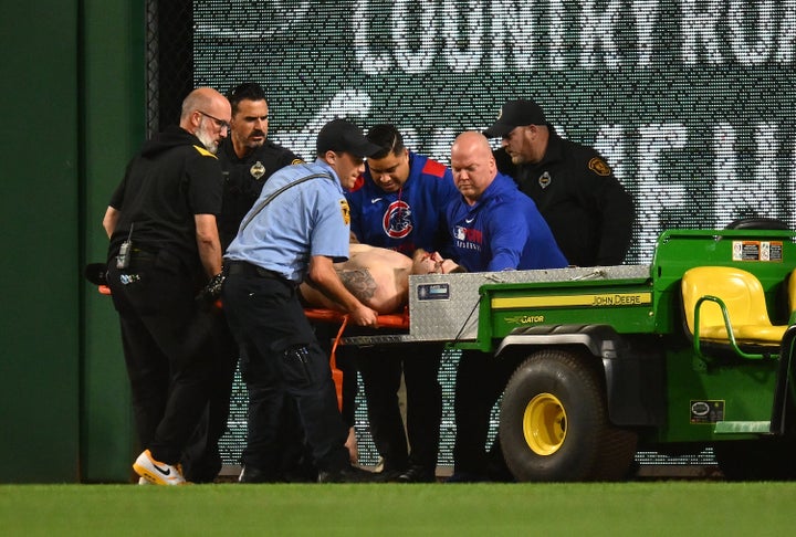 Markwood is carted off the field after falling from the stands. 