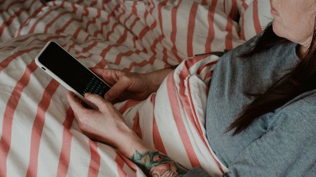 Woman on her phone in bed