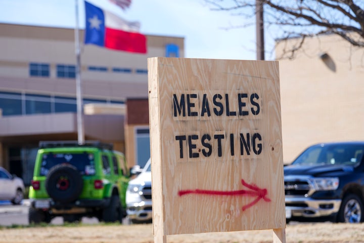 A sign is seen outside of Seminole Hospital District offering measles testing, Feb. 21, 2025, in Seminole, Texas.