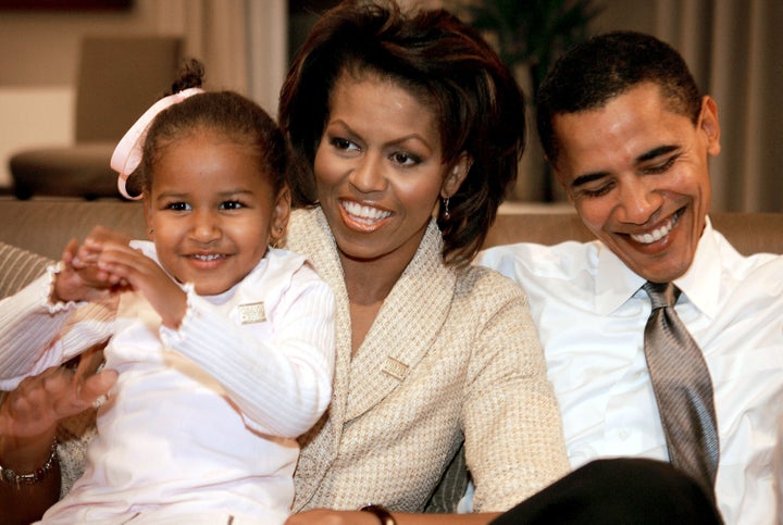 CHICAGO - NOVEMBER 2: Candidate for the U.S. Senate Barack Obama (D-IL) sits with his wife Michelle and daughters Sasha (L) in a hotel room as they wait for election returns to come in November 2, 2004 in Chicago, Illinois. (Photo by Scott Olson/Getty Images)