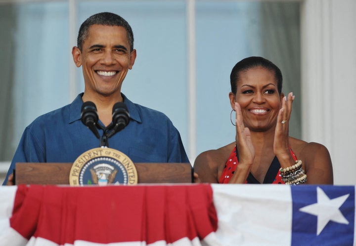 US President Barack Obama speaks as First Lady Michelle Obama applauds during a Fourth of July barbeque for military members and families and government employees and families July 4, 2010 on the South Lawn of the White House in Washington, DC. AFP PHOTO/Mandel NGAN (Photo by Mandel NGAN / AFP) (Photo by MANDEL NGAN-/AFP via Getty Images)