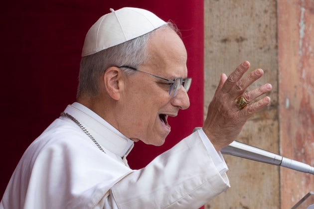Pope Leo XIV speaks from the central balcony of St. Peter's Basilica, where he delivered his first Sunday blessing to the faithful gathered in St. Peter's Square, on May 11.