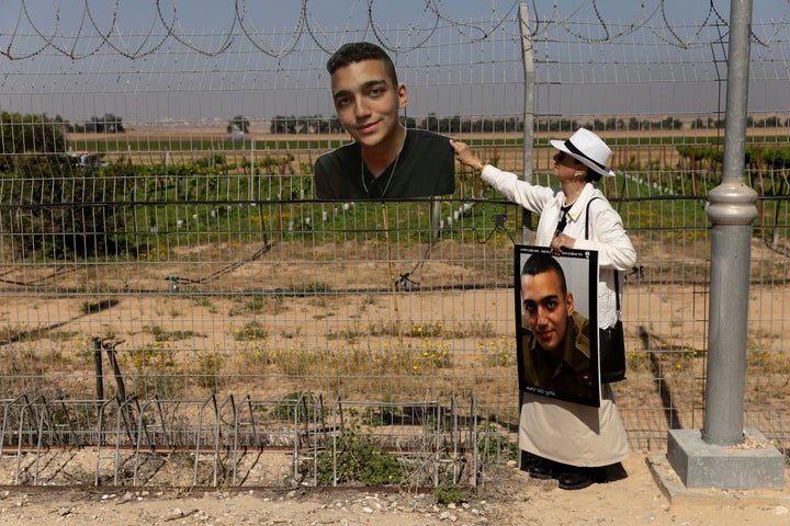 Varda Ben Baruch holds a photo of her grandson, Israeli-American soldier Edan Alexander, during a rally held at Kibbutz Nir Oz by hostages' families near the Gaza border on April 20, 2025. Hamas agreed on May 11 to release Alexander, the last surviving U.S. hostage, in exchange for a ceasefire, and for Israel to reopen the aid corridors that for two months have blocked all humanitarian assistance from reaching Palestinian families.