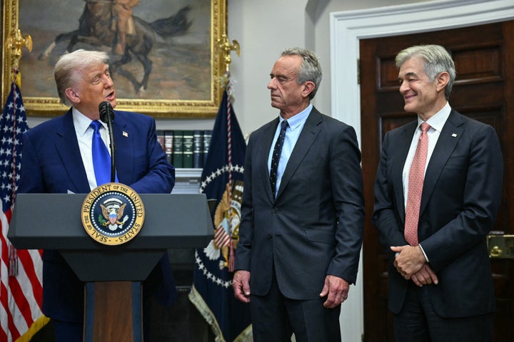 US President Donald Trump speaks as Secretary of Health and Human Services Robert F. Kennedy Jr. (C) and Medicare and Medicaid Administrator Mehmet Oz (R) look on during a news conference about prescription drug prices, in the Roosevelt Room of the White House on May 12, 2025, in Washington, DC. (Photo by Jim WATSON / AFP) (Photo by JIM WATSON/AFP via Getty Images) 