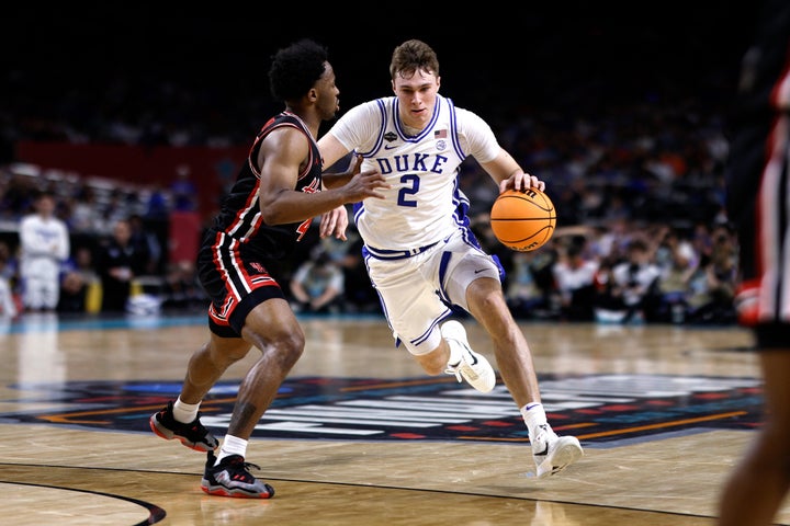 SAN ANTONIO, TEXAS - APRIL 5: Cooper Flagg #2 of the Duke Blue Devils drives with the ball against L.J. Cryer #4 of the Houston Cougars in the first half during the Final Four round of the men's NCAA basketball tournament at Alamodome on April 5, 2025 in San Antonio, Texas. (Photo by Lance King/Getty Images)