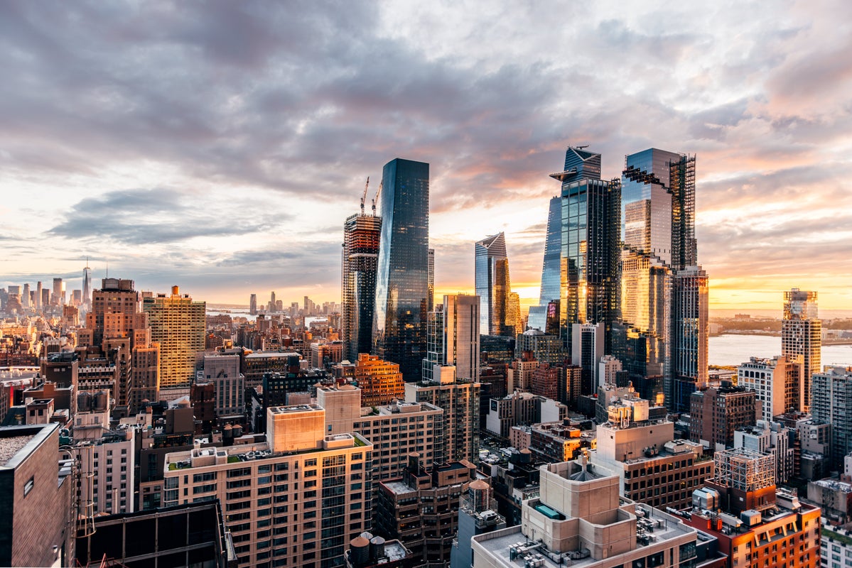 Hudson Yards business district and Manhattan skyline at sunset, aerial view, New York City, USA