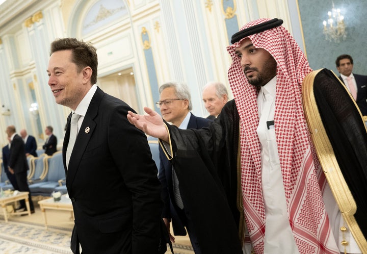 Elon Musk (L) and Nvidia CEO Jensen Huang (C) are directed to greet the Saudi Crown Prince at the Royal Court in Riyadh on May 13, 2025.