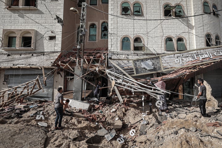 Palestinians inspect the damage from an Israeli airstrike one day earlier outside European Hospital in eastern Khan Younis, Gaza, on Wednesday, May 14, 2025.