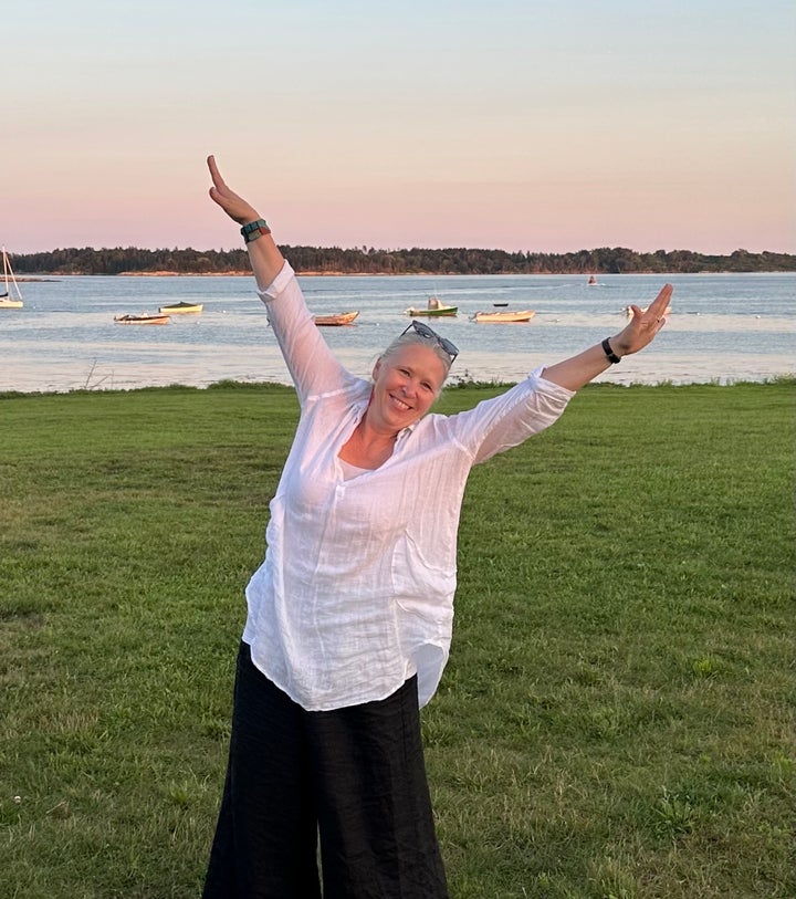 The author in her happy place in Maine, by the ocean, in summer 2023, the day before her wedding.