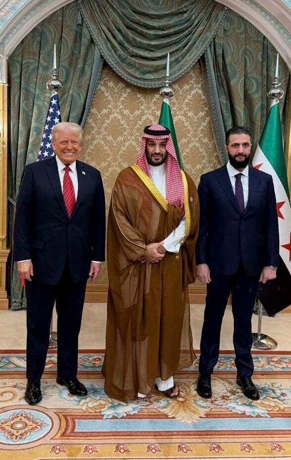 In this photo released by the Syrian official news agency SANA, President Donald Trump, Saudi Crown Prince Mohammed bin Salman, and Syria's interim President Ahmad al-Sharaa, pose in Riyadh on May 14, 2025. 