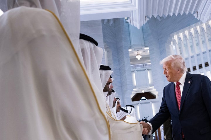 US President Donald Trump shakes hands with Qatari officials upon his arrival to meet with Qatar's Emir Sheikh Tamim bin Hamad al-Thani in Doha on May 14, 2025. Trump touched down at Hamad International Airport in Doha, with relations between the two governments in the spotlight over Qatar's offer to Trump of a $400 million luxury aircraft to serve as a new Air Force One and then pass into his personal use. (Photo by Brendan Smialowski / AFP) (Photo by BRENDAN SMIALOWSKI/AFP via Getty Images) 