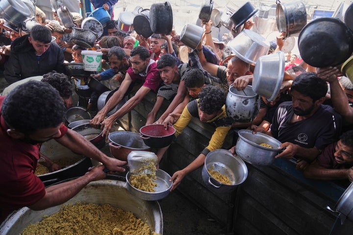 Israeli Strikes Kill At Least 93 Individuals In Gaza As Trump Wraps Up Center East Go to 3 Palestinians struggle to get donated food at a community kitchen in Khan Younis, Gaza Strip, Friday, May 16, 2025. (AP Photo/Abdel Kareem Hana)