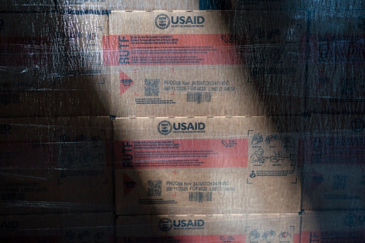 Boxes of Plumpy'Nut, a nutritional lifesaving peanut paste sent to malnourished children worldwide, are labeled with "USAID" as they sit waiting to be shipped from Edesia Nutrition's warehouse, Friday, March 14, 2025, in North Kingstown, R.I. (AP Photo/David Goldman)