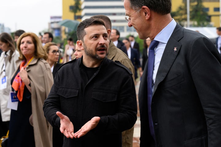 Ukraine's President Volodymyr Zelenskyy speaks with NATO Secretary General Mark Rutte during the European Political Community (EPC) summit, in Tirana on May 16, 2025. (Photo by Leon Neal / POOL / AFP via Getty Images)
