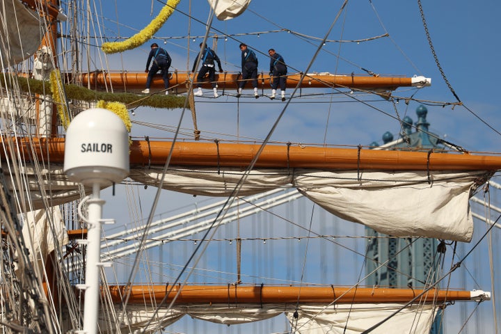 Sailors work on the yard arms of the Cuauhtémoc, Sunday, May 18, 2025 in New York. The masted Mexican Navy training ship collided with the Brooklyn Bridge the night before. (AP Photo/Yuki Iwamura)
