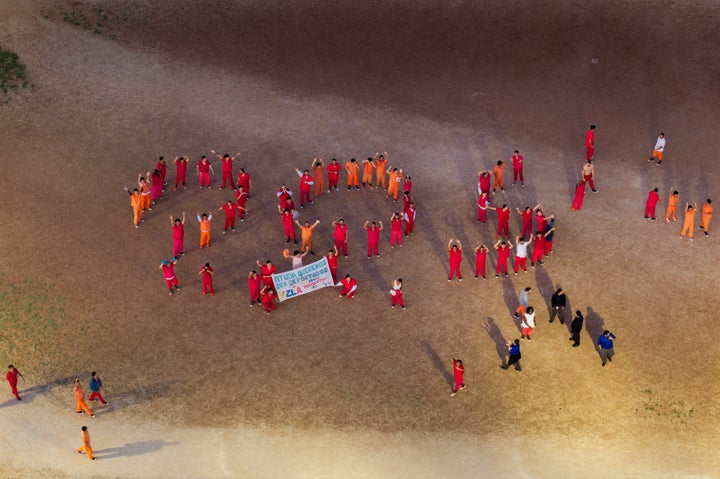 Venezuelan immigrants detained at the Bluebonnet Detention Center in Anson, Texas, form an S.O.S. in the courtyard.