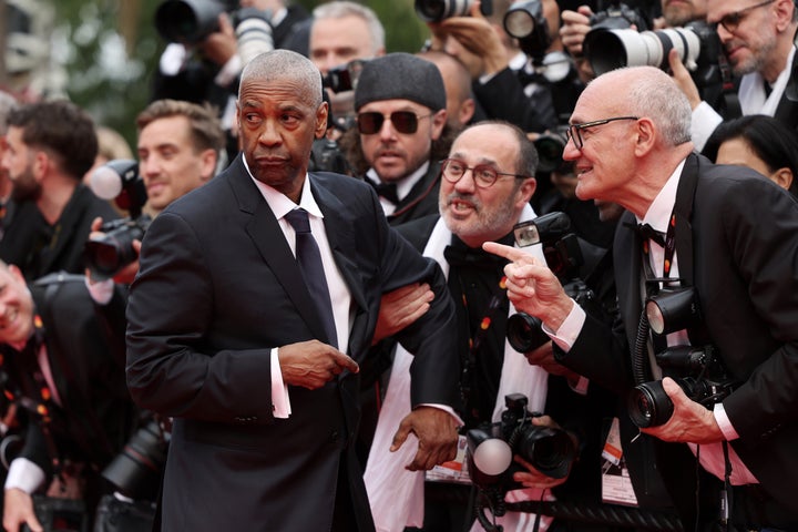 Denzel Washington Has 2 Blunt Phrases For Photographer In Heated Purple Carpet Second - The Boston Courier 2 The photographer grabs Washington's arm again as the actor turns away.