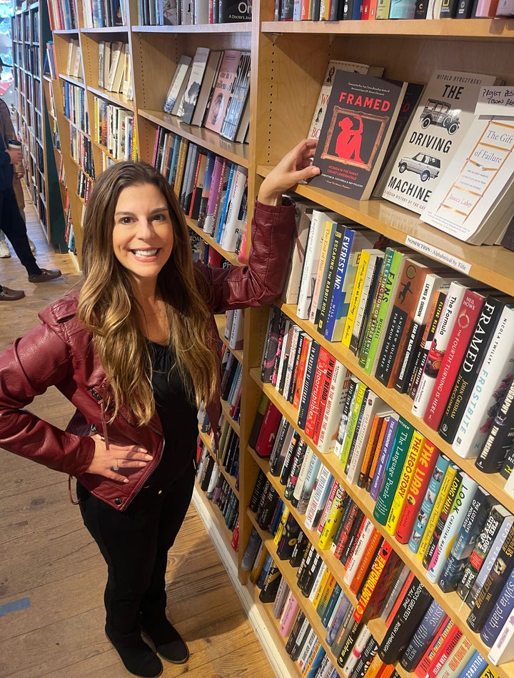 The author in the bookstore Books on the Common which carries the book she co-authored, "FRAMED."