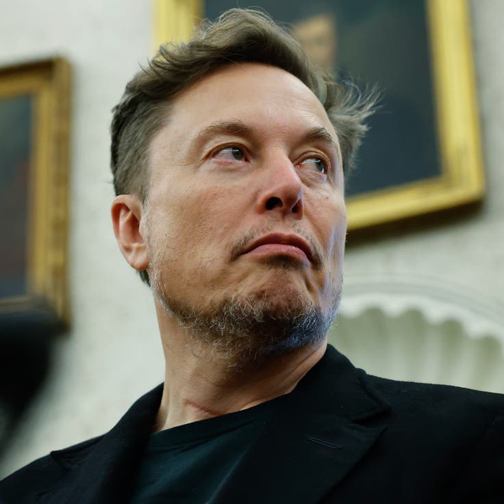 Elon Musk listens as reporters ask U.S. President Donald Trump and South African President Cyril Ramaphosa questions during a press availability in the Oval Office at the White House on May 21, 2025, in Washington, D.C. 