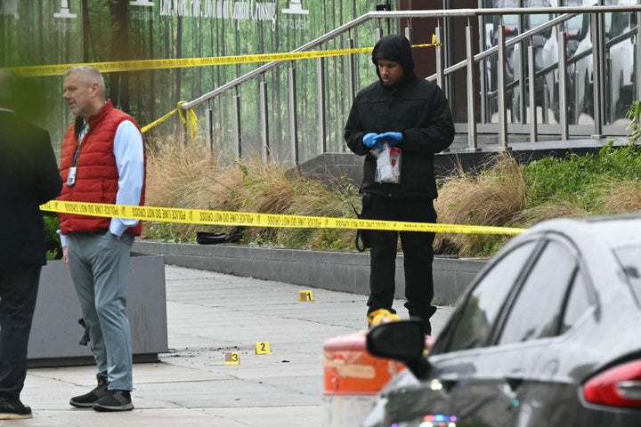Forensics officers investigate the shooting site outside the Capital Jewish Museum following a shooting that left two people dead, in Washington, D.C., on May 22, 2025.