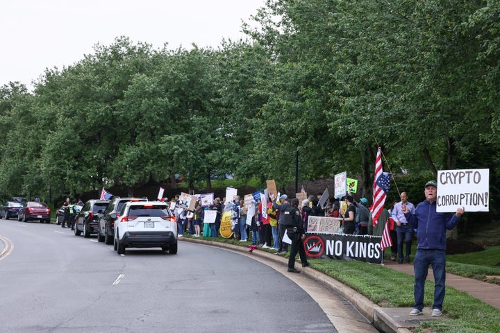 WASHINGTON, DC - MAY 22: Demonstrators hold up signs during the "America is Not for Sale" Rally Against Trump's Crypto Dealings at the Trump National Golf Club on May 22, 2025 in Washington, DC. (Photo by Jemal Countess/Getty Images for Public Citizen)
