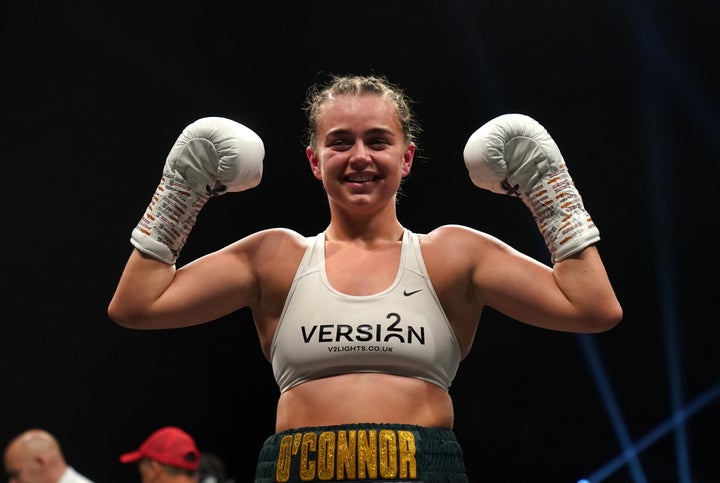 Georgia O'Connor smiles in victory after a bout in April 2022.