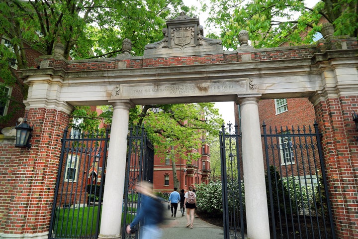 People enter Harvard Yard through a gate on May 2, 2025. (John Tlumacki/The Boston Globe via Getty Images)