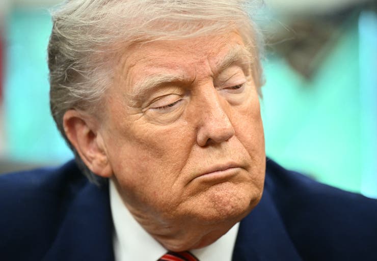 President Donald Trump prepares to sign executive orders in the Oval Office of the White House in Washington on May 23, 2025.