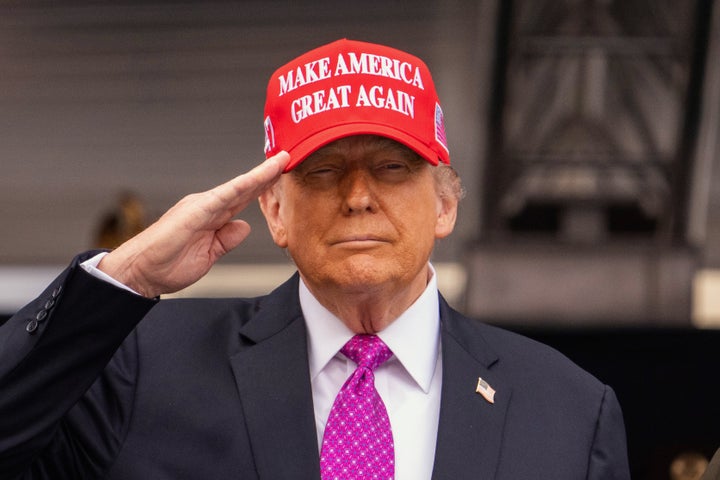 President Donald Trump salutes during the United States Military Academy commencement ceremonies in West Point, N.Y., Saturday, May 24, 2025. (AP Photo/Adam Gray)