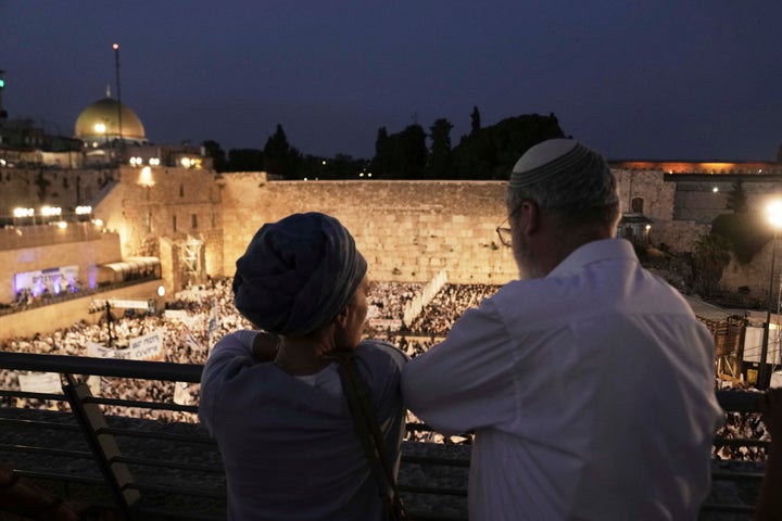 Israelis gather at the Western Wall, the holiest site where Jews can pray, to mark Jerusalem Day, an Israeli holiday celebrating the capture of east Jerusalem in the 1967 Mideast war, in Jerusalem's Old City, Monday, May 26, 2025. (AP Photo/Maya Alleruzzo)