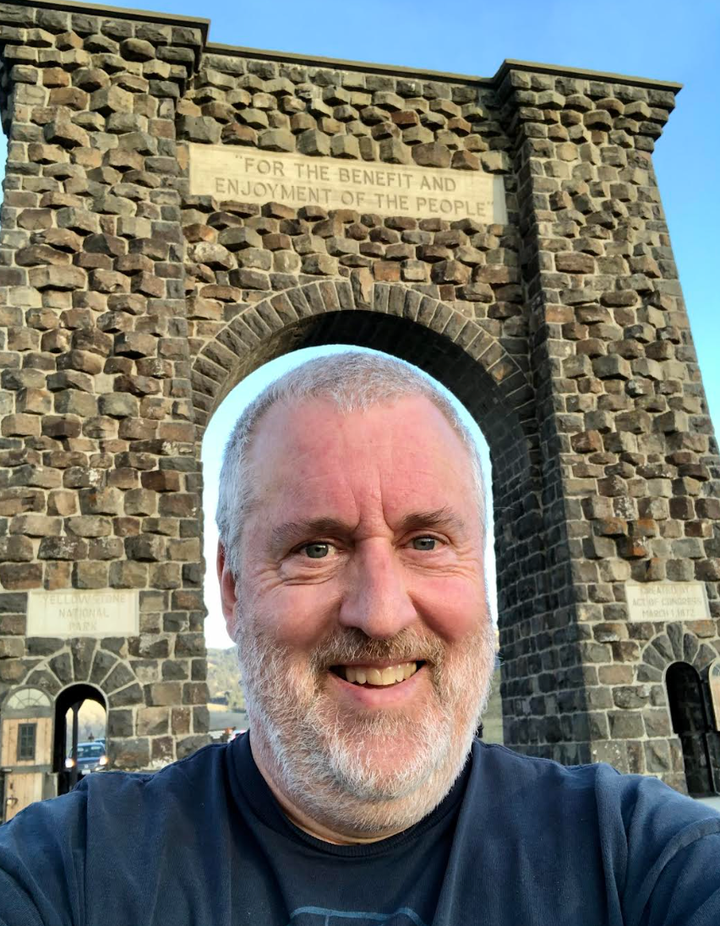 The author passes under the iconic Roosevelt Arch near Gardiner, Montana, marking Yellowstone’s North entrance. "Since my EMPD diagnosis, I've found travel to be a great stress reliever," he writes.