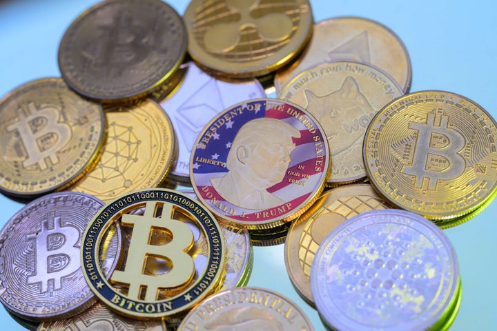 A Trump coin is seen among cryptocurrency coins.