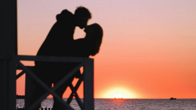 Couple kissing on beach