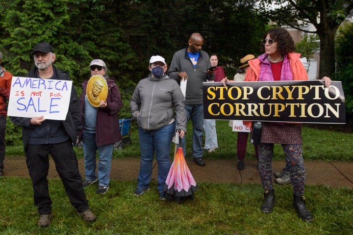 Demonstrators protest near Trump National Golf Club near Washington, D.C., before the arrival of President Donald Trump in Sterling, Virginia, on Thursday.