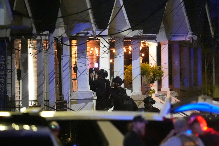 Louisiana State Police enter a house in search of a fugitive who escaped from a New Orleans jail on May 20, 2025.