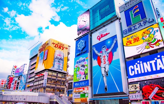 It is lined with shops and flashy advertisements.