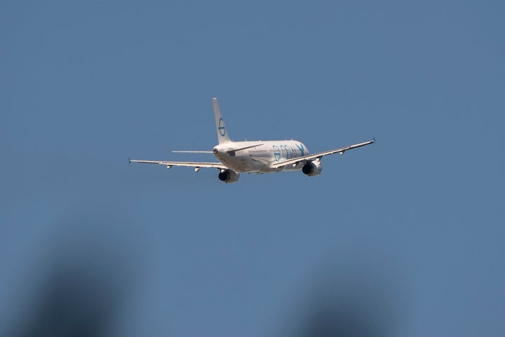 A plane chartered by ICE flies deportees from Seattle on April 15.