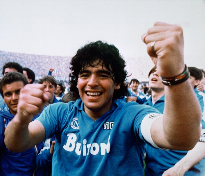 Argentine soccer superstar Diego Armando Maradona cheers after the Napoli team clinched its first Italian major league title in Naples, Italy, on May 10, 1987. (AP Photo/Massimo Sambucetti, File )