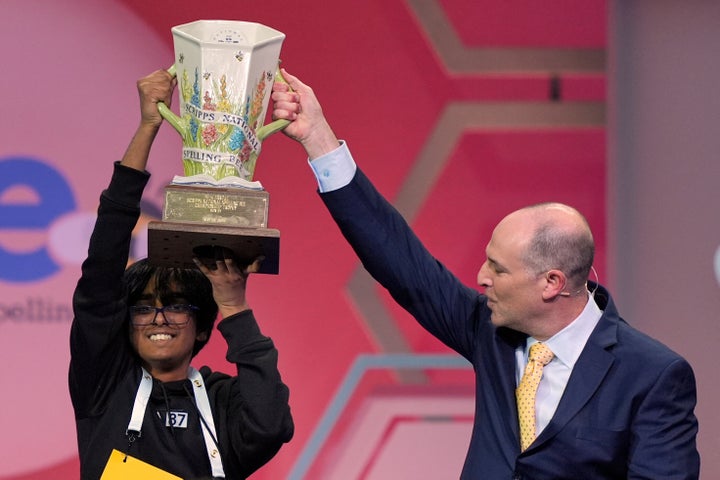 E.W. Scripps Company president and CEO Adam Symson presents the trophy to Faizan Zaki, 13, of Dallas, the winner of the 2025 Scripps National Spelling Bee, Thursday, May 29, 2025, in Oxon Hill, Md. (AP Photo/Julia Demaree Nikhinson)