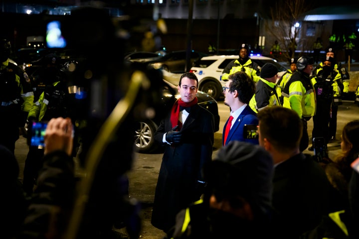 Paul Ingrassia (left), White House liaison to the Justice Department, announces the release of brothers Andrew and Matthew Valentin outside the D.C. Central Detention Facility on Jan. 20. President Donald Trump issued pardons to over 1,500 people who were charged with crimes related to the Jan. 6, 2021, insurrection attempt.