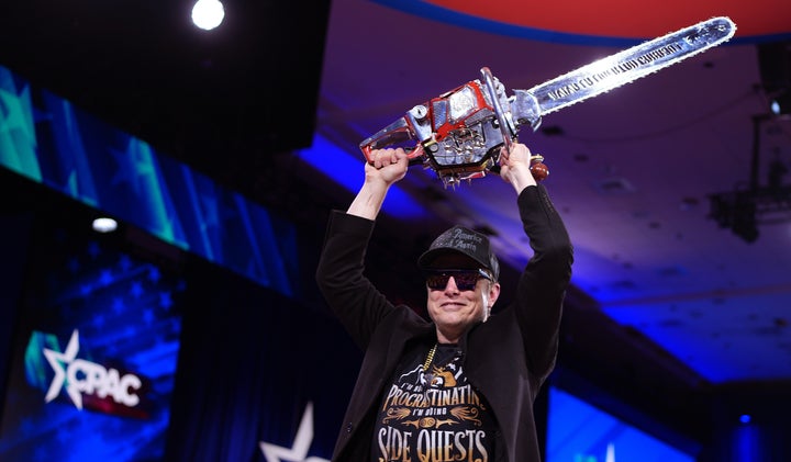CEO of Tesla and SpaceX Elon Musk leaves the stage holding a chainsaw after speaking at the Conservative Political Action Conference at the Gaylord National Resort Hotel And Convention Center on Feb. 20, 2025, in Oxon Hill, Maryland.