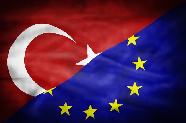 Wavy flag of Turkey and European Union fills the frame.