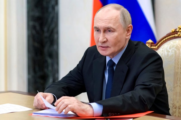 Russian President Vladimir Putin chairs a Security Council meeting via videoconference at the Kremlin in Moscow.